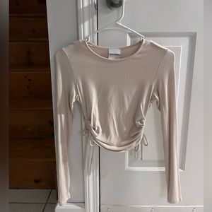 Long sleeve shirt with tie on the side